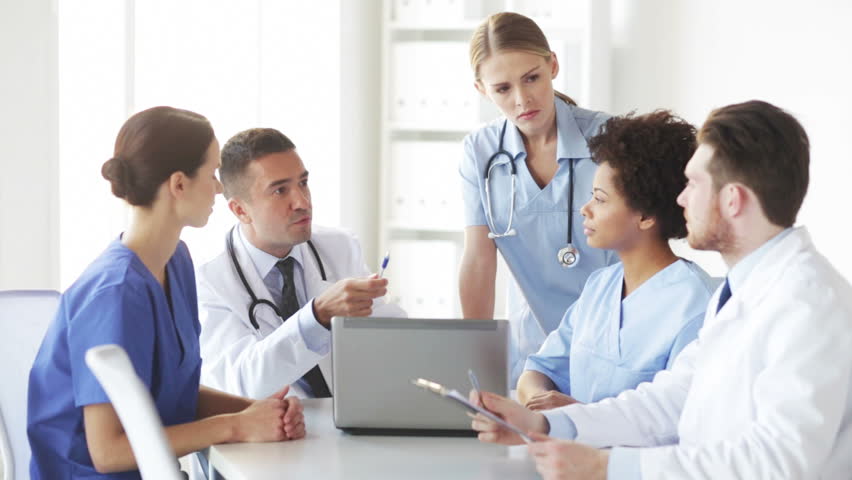 Medical Team Working With A Computer Together In A Meeting Room Stock 