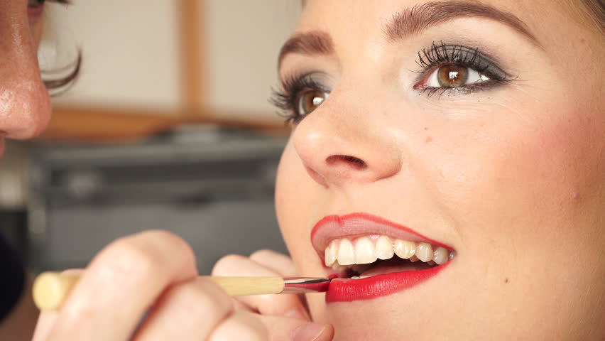 Makeup Artist Applying Red Lipstick To Model Lips 4k Stock