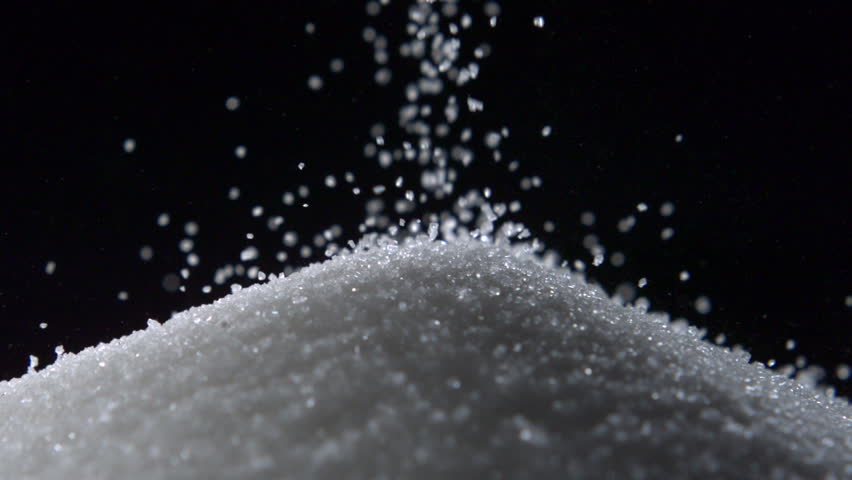 Pile Of Sugar On Black Background Shooting With High Speed ...