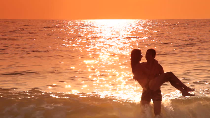 Loving Teen Couple Have Fun On The Beach At Sunset Stock Footage Video