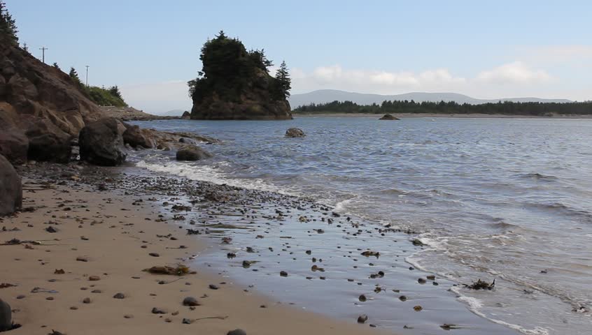 Tillamook Bay In Garibaldi Oregon Rocky Beach At Lowtide With Waves And