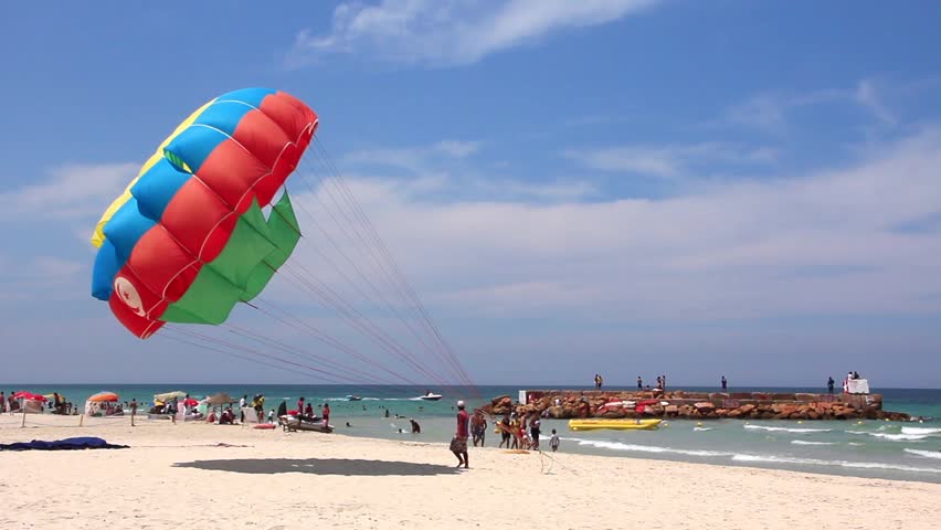 Parasailing. Color Parachute On The Beach Stock Footage ...