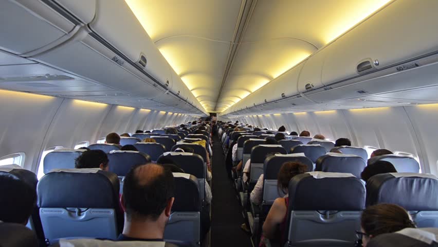 Inside Airplane Passengers Sitting In Aircraft Airborne Flying