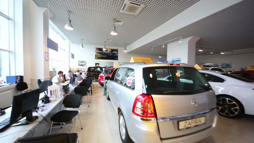 RUSSIA, MOSCOW - AUG 28, 2012 Review Hall With Clients Desk And Cars In ...