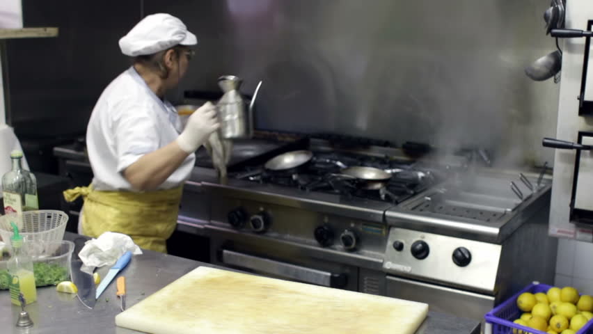Restaurant Kitchen Video chef in restaurant kitchen cooking mussels stock footage video Restaurant Kitchen Video chef in restaurant kitchen cooking mussels stock footage video