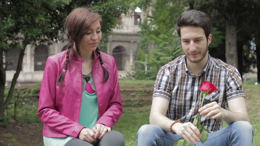 A Shy Man Gives A Red Rose To A Beautiful Woman Love Lover Fond