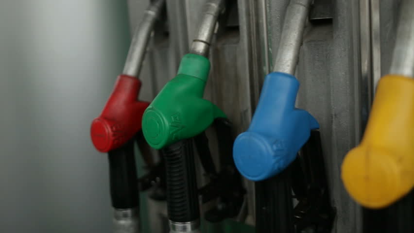 diesel-fill-at-gas-pump-yellow-pump-handle-green-car-stock-footage