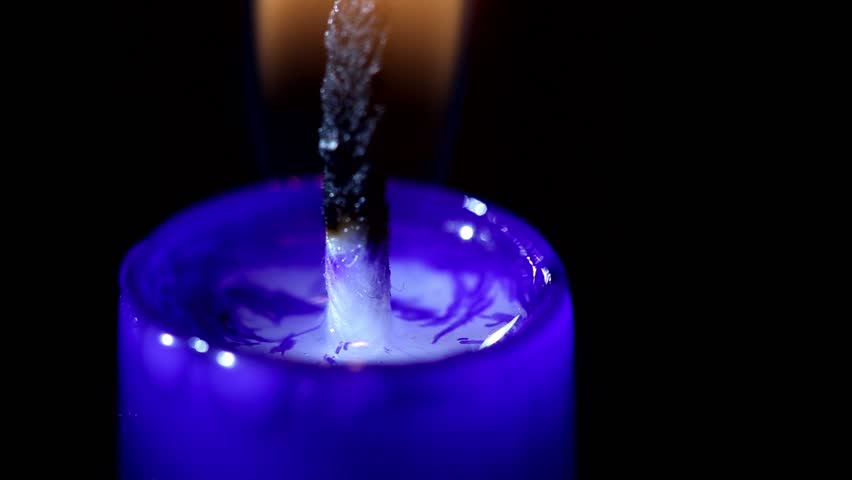 Close-up Timelapse Burning Blue Candle With Black Background Stock