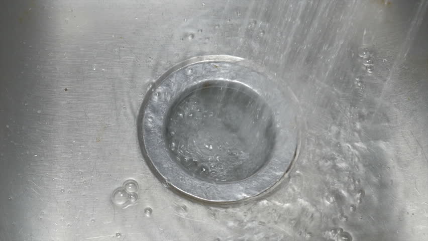 water spraying under kitchen sink