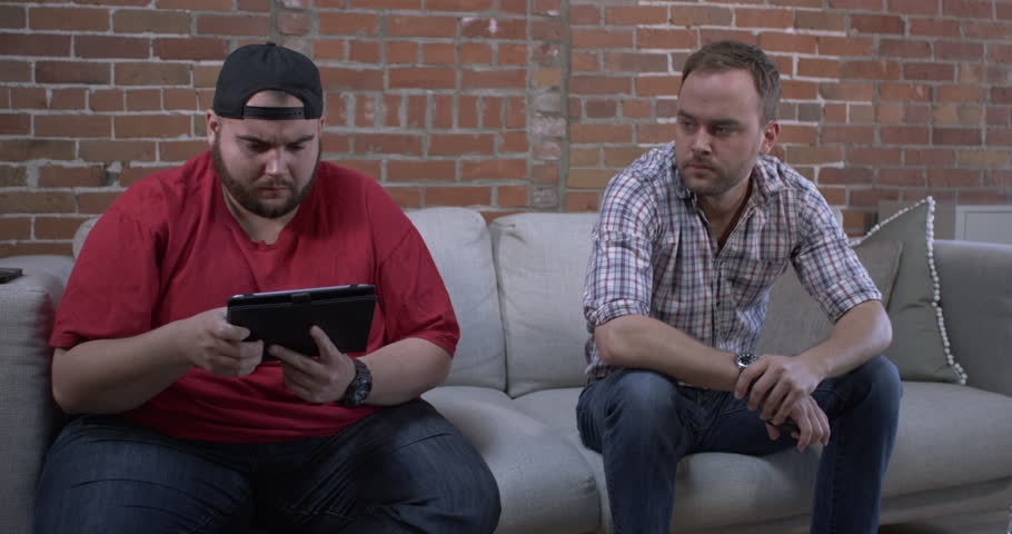 Two Guys Sitting On Couch - Watching TV Together Stock Footage Video ...