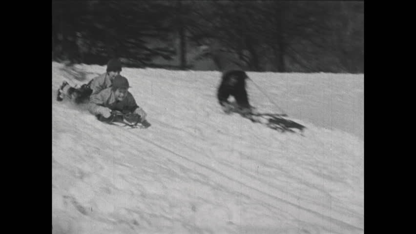 UNITED STATES 1940s: Kids Pull Sleds In Snow, Boy Positions Sled / Boy ...