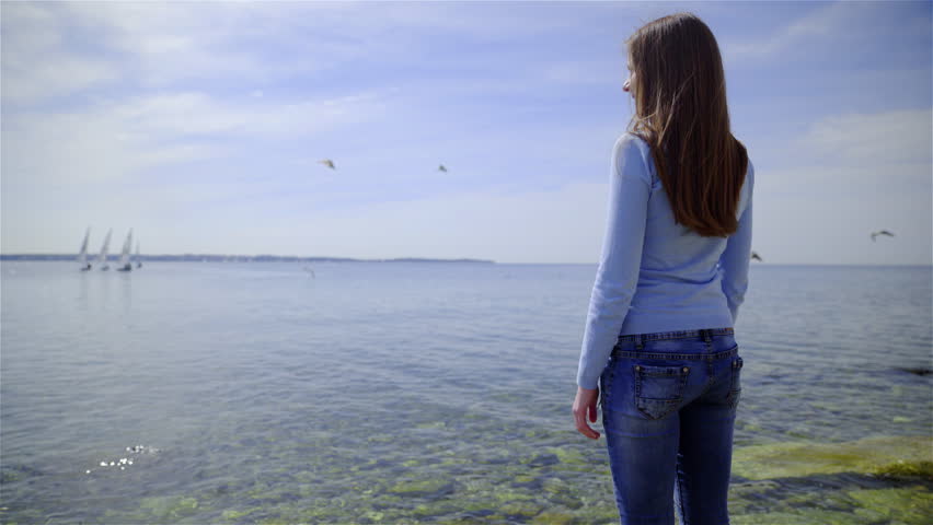 Woman Looking In Distance At Sea 4K. Behind The Back View Female Person ...