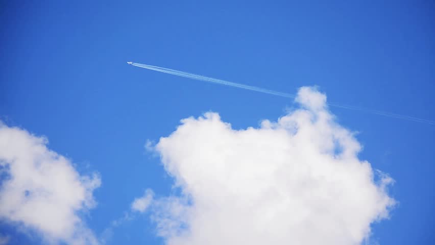 Jet Aircraft Streaking Across Blue Sky With Contrail. Stock Footage ...