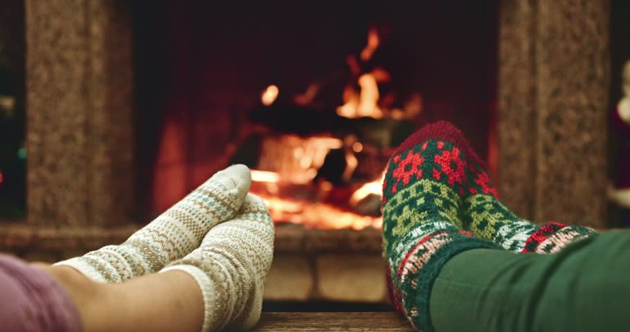 Feet In Woollen Socks Warming By Cozy Fire In Christmas Time In Slow ...