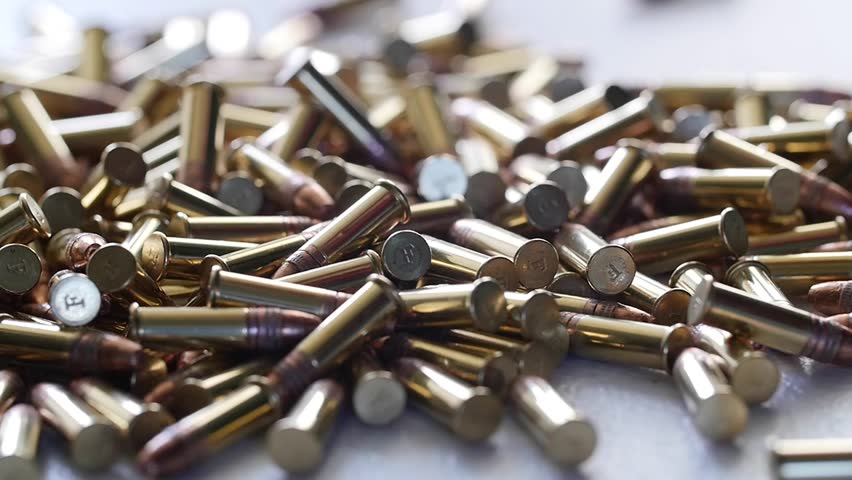 A Slow Motion Dolly Shot Of A Pile Of Bullets Stock Footage Video ...