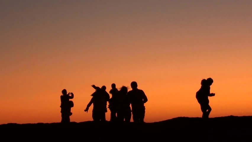 Group Of Business People Silhouettes Walking Against Beautiful Sunset ...