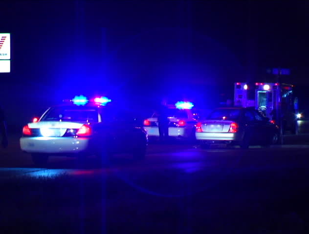 Close Up Up The Side Door Of A Police Car With Its Lights Flashing DV ...