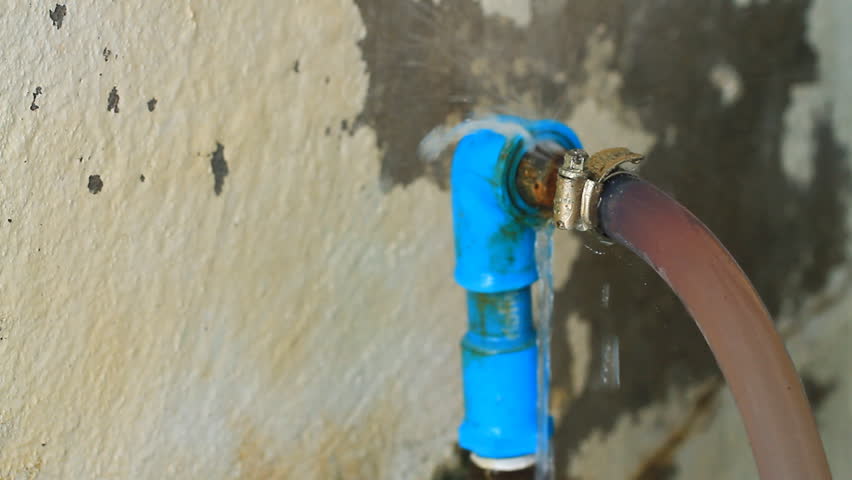 An Old Broken Pipe That Leaks Water In All Directions. Stock Footage ...