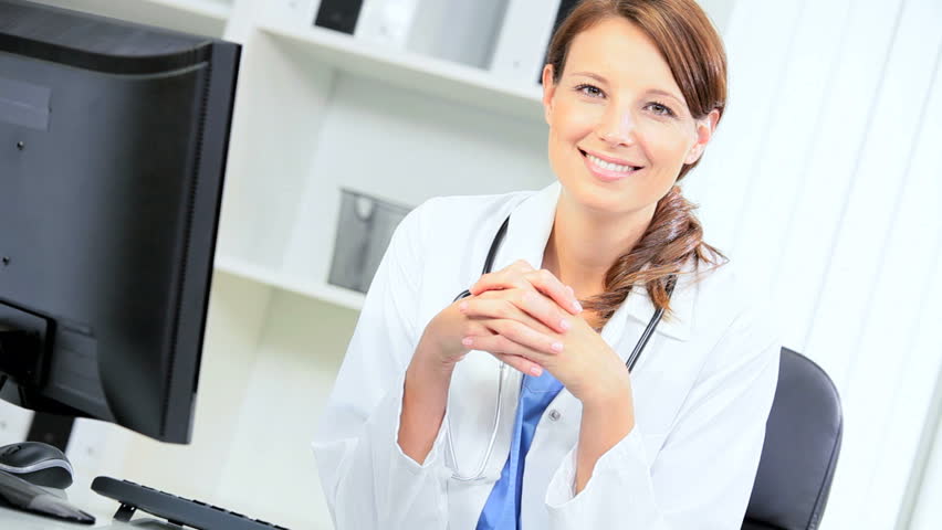 Close Up Ambitious Young Female Medical Consultant Updating Patient ...