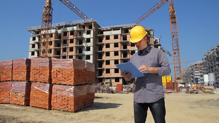 One beelding-engineer explains something to a worker in my country. One beelding-engineer explains something to a worker in my country.