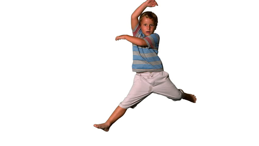 Side View Of Happy Boy Jumping Up And Down On White Background In Slow ...