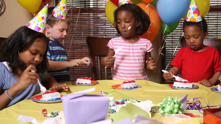 Girl Blows Out Candles On Birthday Cake In Slow Motion With Family At ...