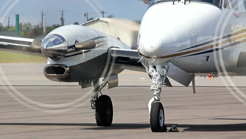 Man Approaches Front Of Propeller Airplane, And Begins To Inspect ...