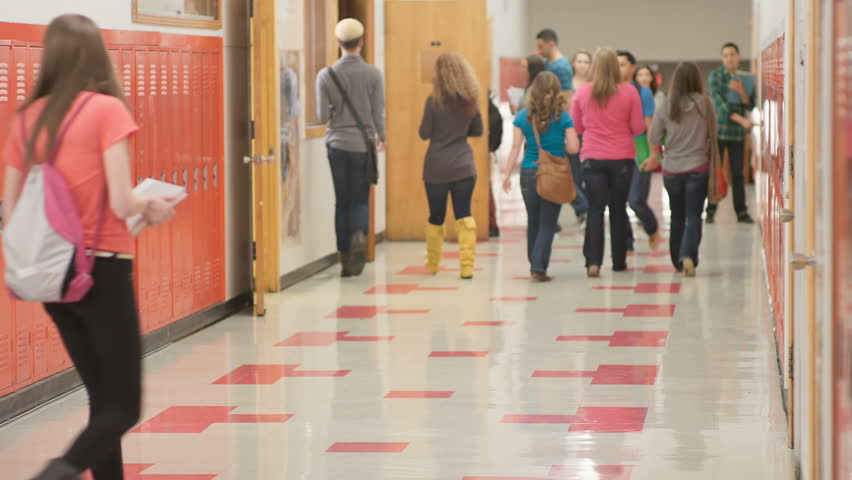 A Busy School Hallway With Students Walking To And From Class Stock ...