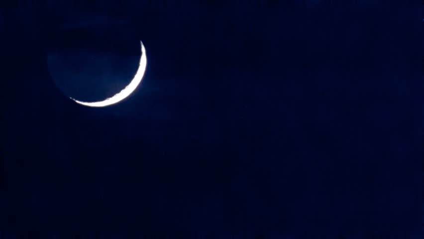 The Moon Down. Nice Crescent Moon Through Passing Clouds. High ...