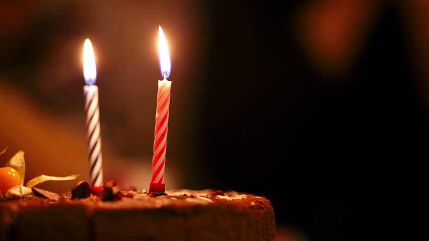 Two Candles On Birthday Cake Burning In The Darkness. Stock Footage ...