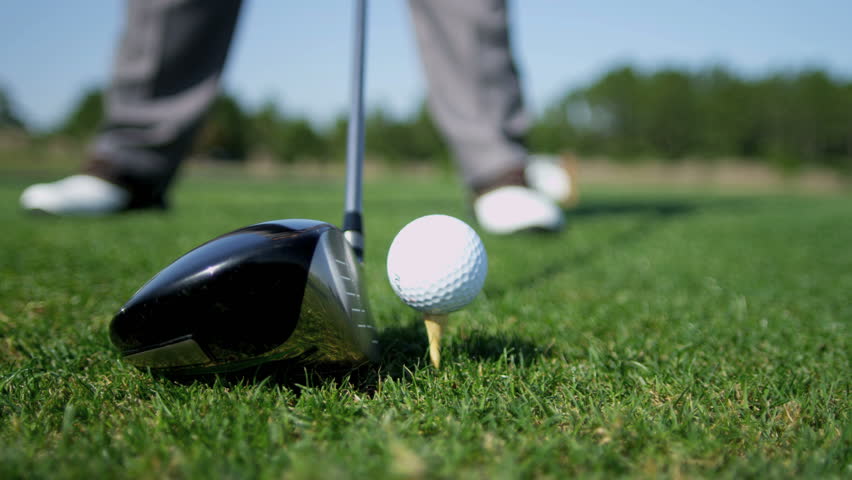 Caucasian Professional Golfer Taking Swing Hitting Golf Ball Off Tee On ...