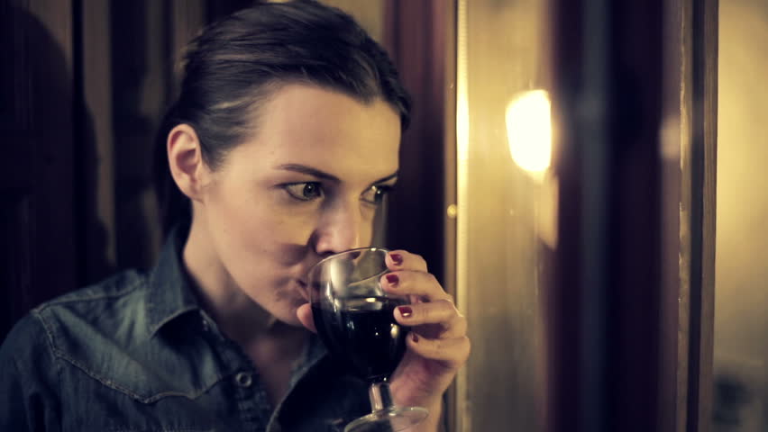 Sad, Beautiful Woman Drinking Wine By The Window At Night Stock Footage ...