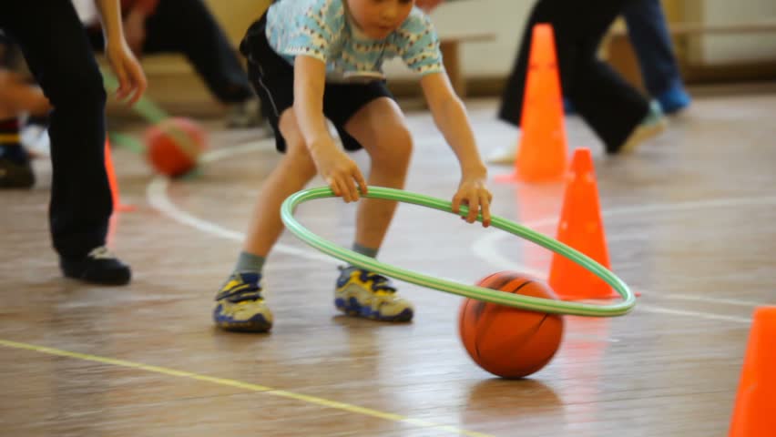 Boy Rolling A Ball By Hoop Stock Footage Video 558529 - Shutterstock