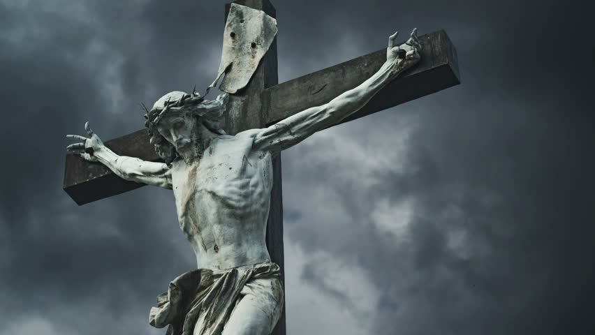 Crucifixion. Christian cross with Jesus Christ statue over stormy ...