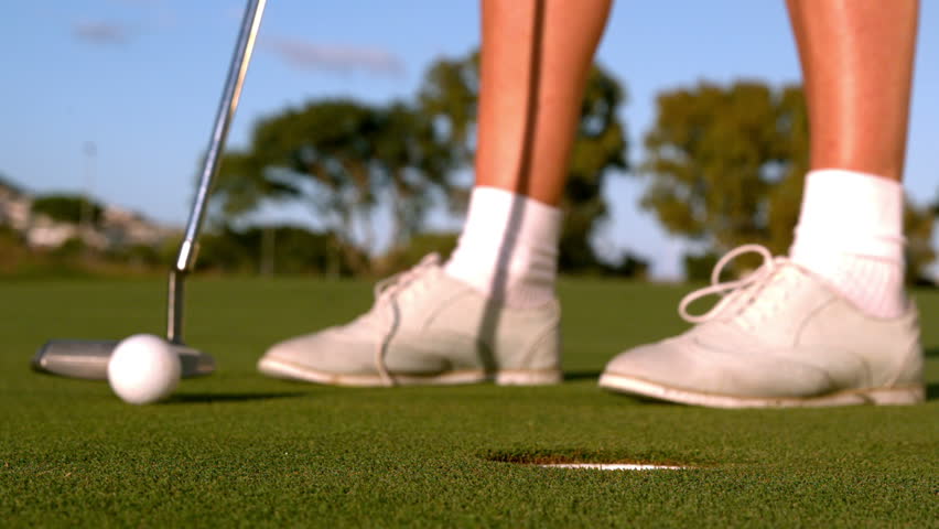 Lady Golfer Putting Golf Ball On The Green In Slow Motion Stock Footage ...