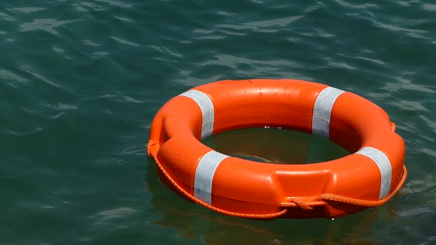 Close Up Shot Of A Red Rescue Buoy Leaned On A Pier/A Lifebuoy On A ...