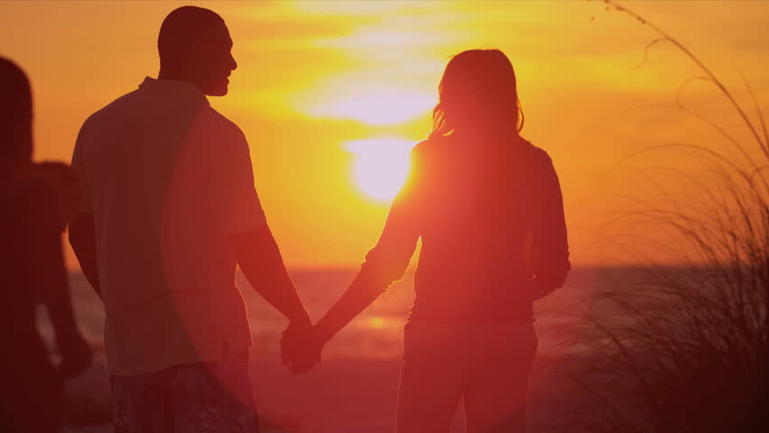 Loving Couple Holding Hands Beach Vacation Sunset - Young Ethnic Couple ...