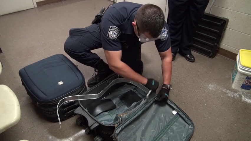 CIRCA 2010s - Homeland Security Agents Find Heroin In Suitcases At An ...