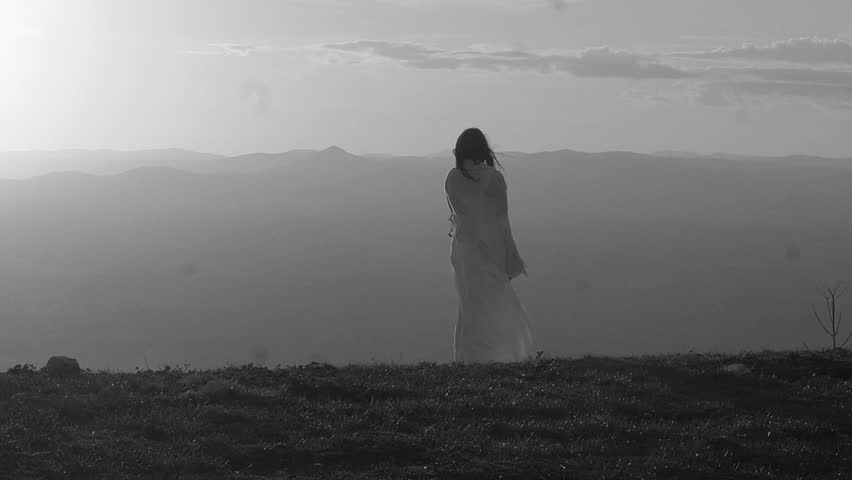 Sad Lonely Woman Standing Alone Against A Beautiful Sunset Stock ...