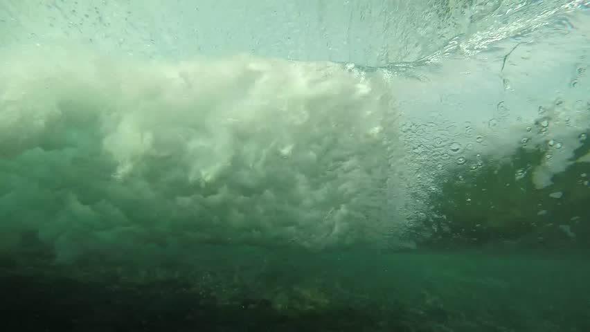 Slow Motion Underwater View Of Surfing Wave Breaking Over Coral Reef In ...