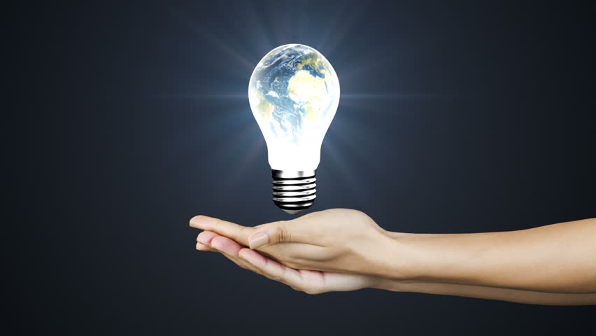 Hand Holding A Light Bulb In The Dark, The Lamp Lights Up Stock Footage ...